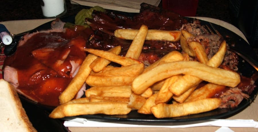 A classic Kansas City barbecue plate featuring brisket burnt ends and ribs.