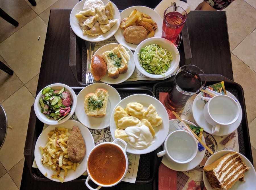 Traditional Slobozhan borscht served with garlic pampushky rolls.