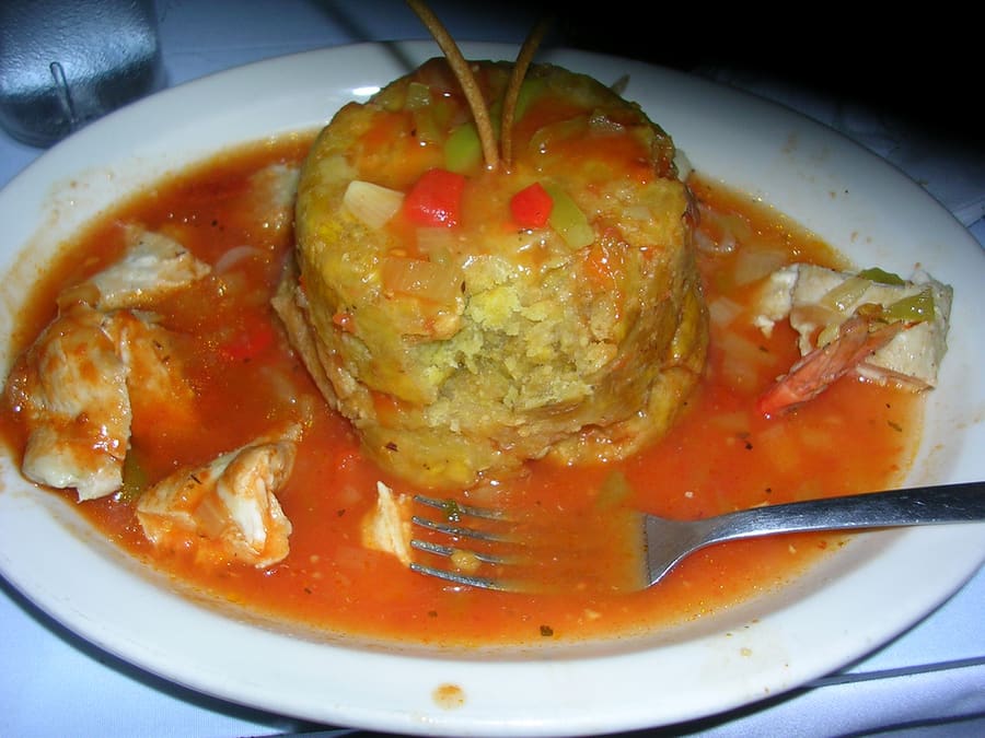 Mofongo topped with roast pork, a staple dish along Vine Street.