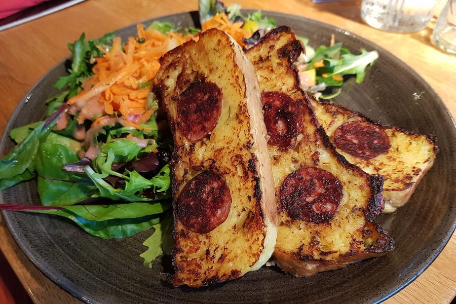 Dippekuchen, a traditional crusty potato dish cooked in a heavy iron pot.
