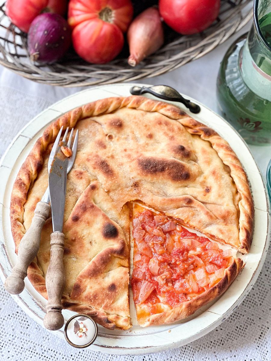 Lakror baked under a traditional iron saç in a Korçë tavern.