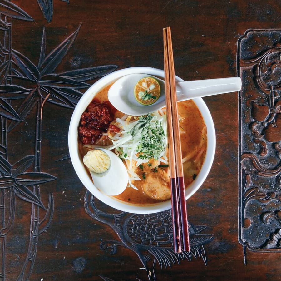 Sabah laksa served with poached prawns and local calamansi lime.
