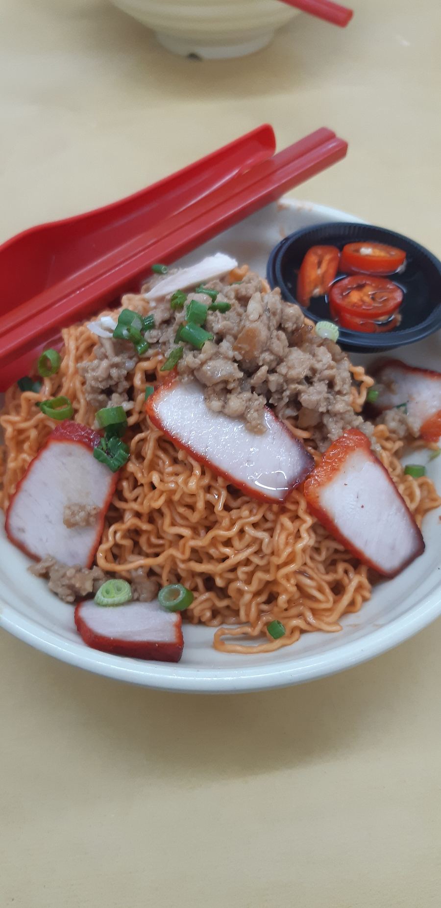Kolo mee served dry with pork slices and minced meat at a downtown kopitiam.