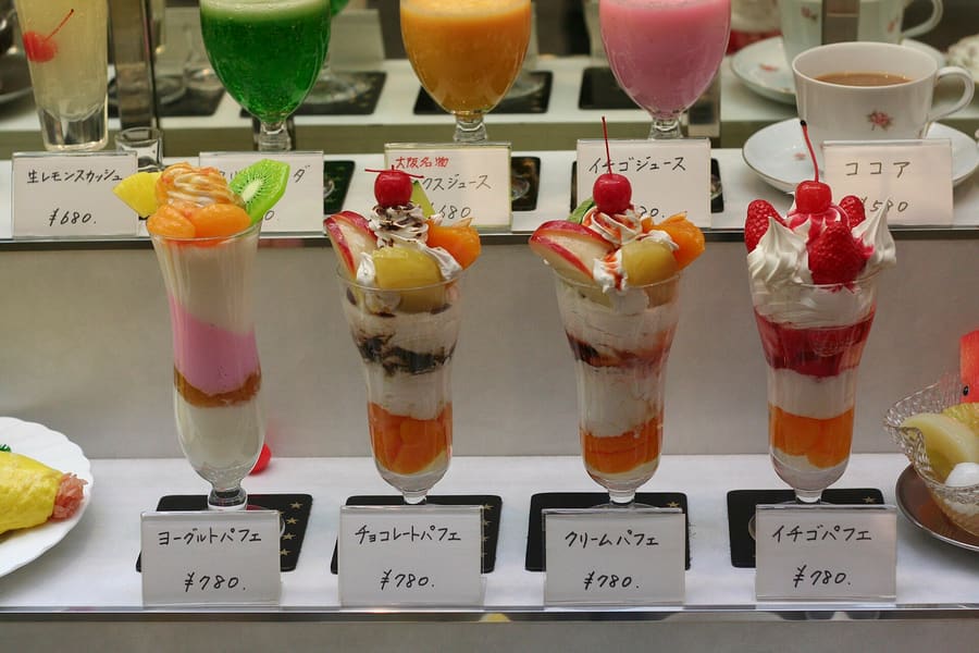 Seasonal fruit parfaits showcase Okayama white peaches and Muscat grapes.