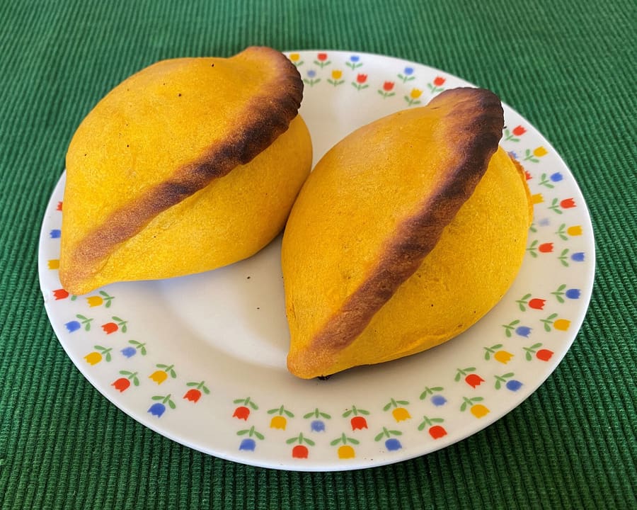 A traditional mid-morning salteña filled with spiced meat soup.