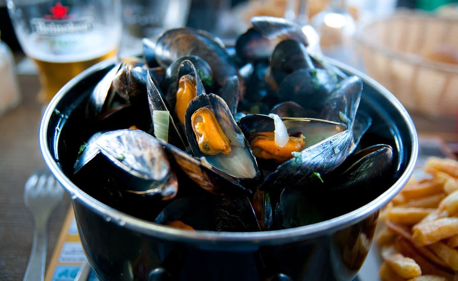 Mussels steamed with white wine and shallots are a staple along the waterfront.