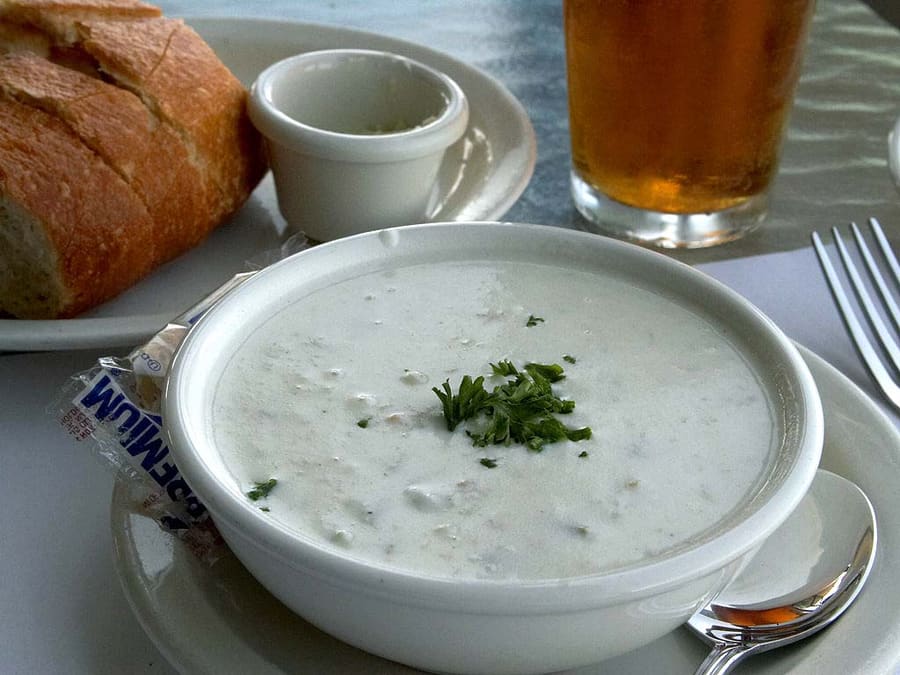 Pan-fried razor clams and thick-cut clam chowder define local coastal menus.