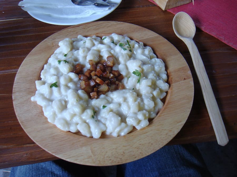 Bryndzové halušky served with lard fried bacon bits in Liptovský Mikuláš.