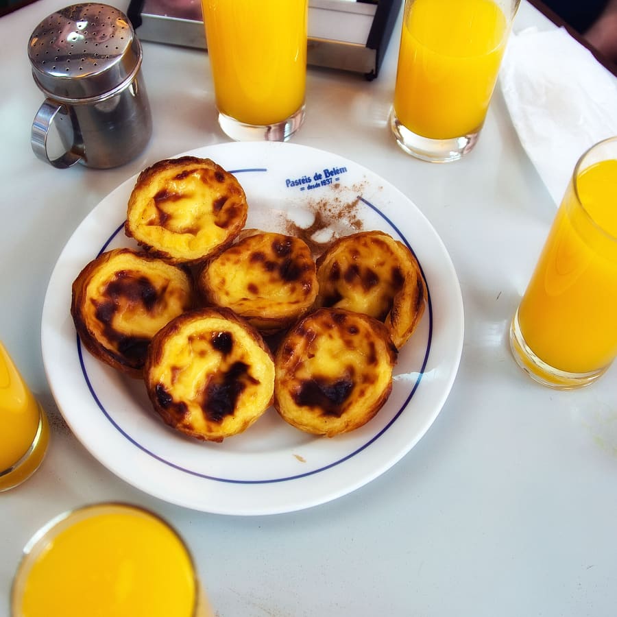 Warm Pastéis de Belém served with cinnamon at the original bakery.