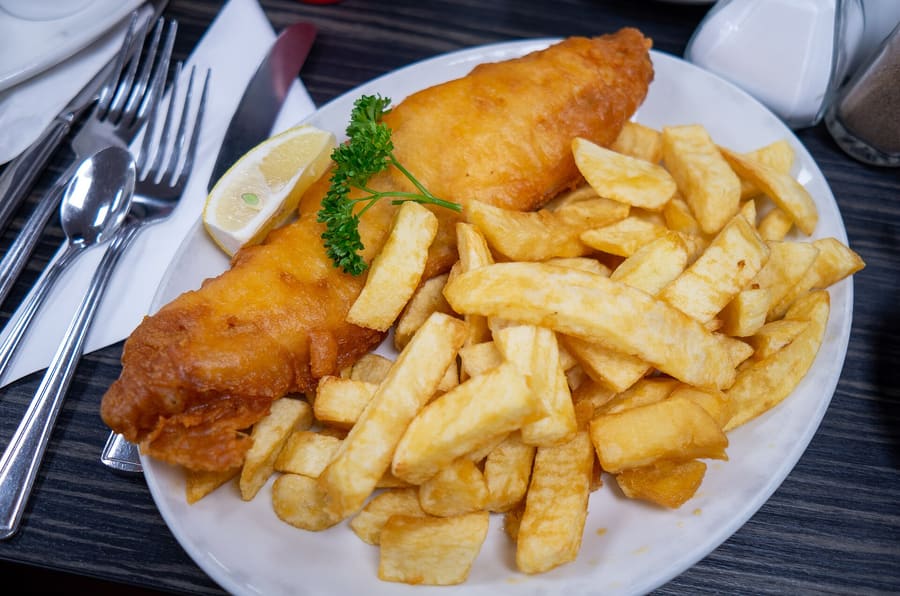 Freshly battered cod and chips eaten on the South Pier wall.