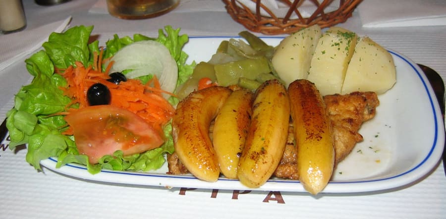 Traditional espada com banana served with boiled potatoes.