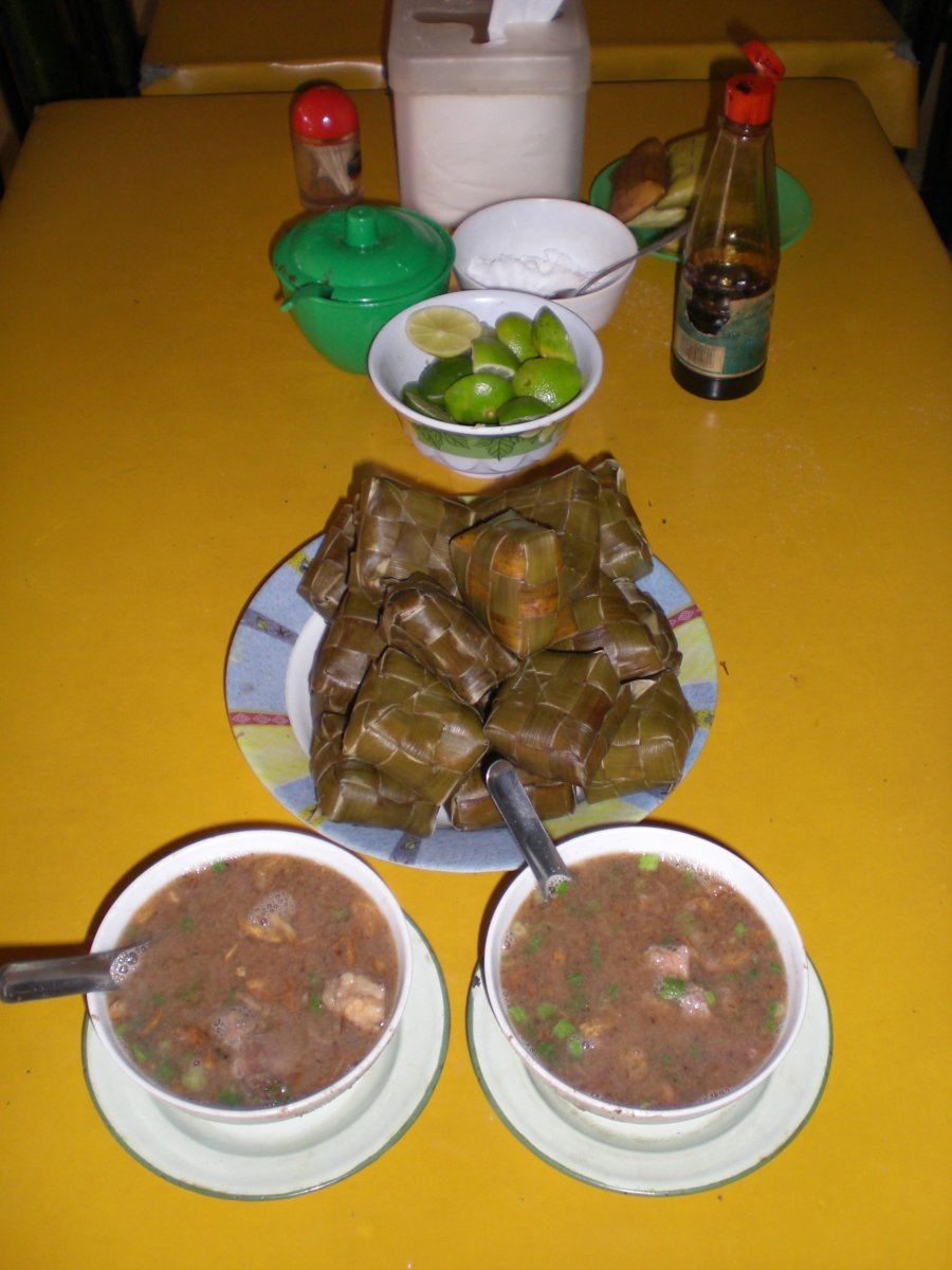 Coto Makassar, rich beef soup served with ketupat rice cakes.