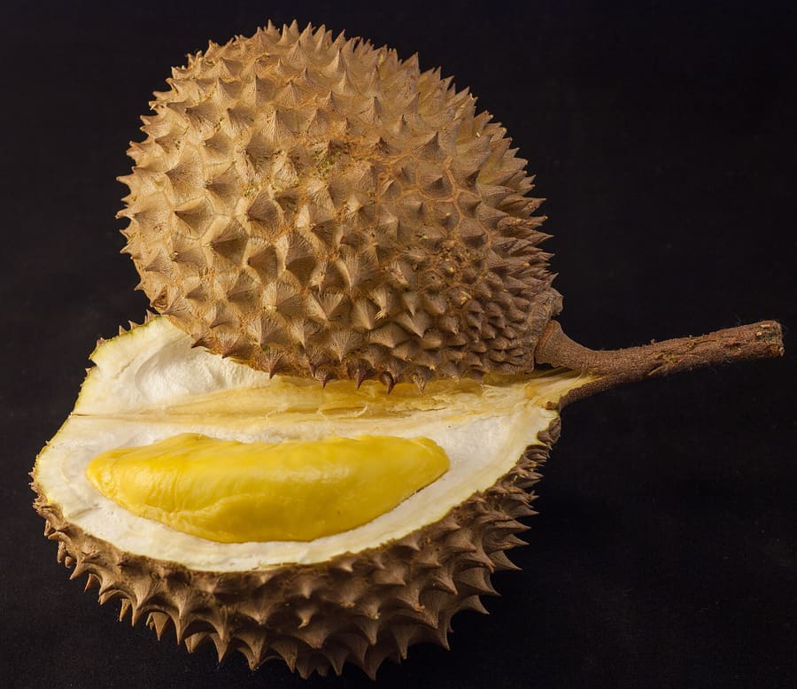 Durian vendors operate late into the night along major thoroughfares.
