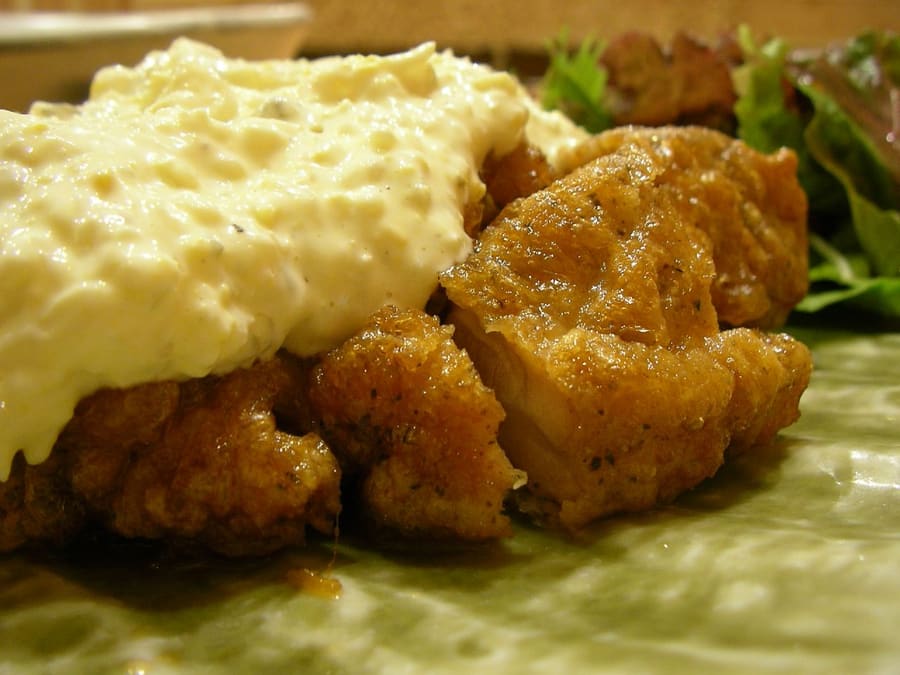 Chicken nanban served with tartar sauce, cabbage, and rice.