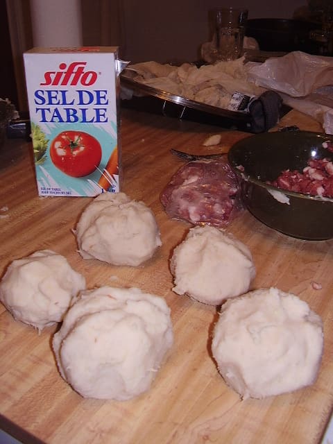 Poutine râpée, a traditional Acadian boiled potato dumpling filled with pork.