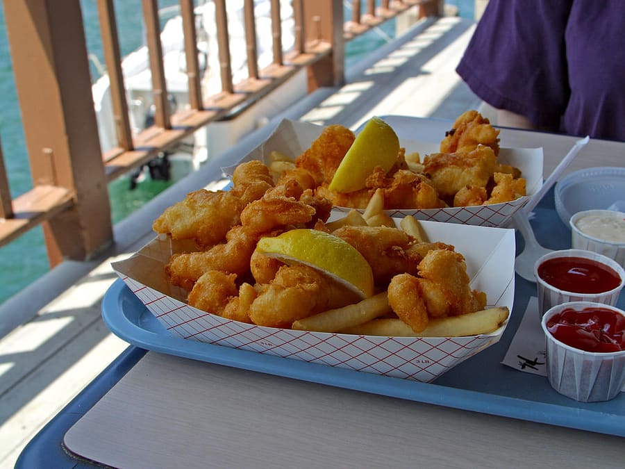 Traditional Calabash fried seafood platter served with hushpuppies.