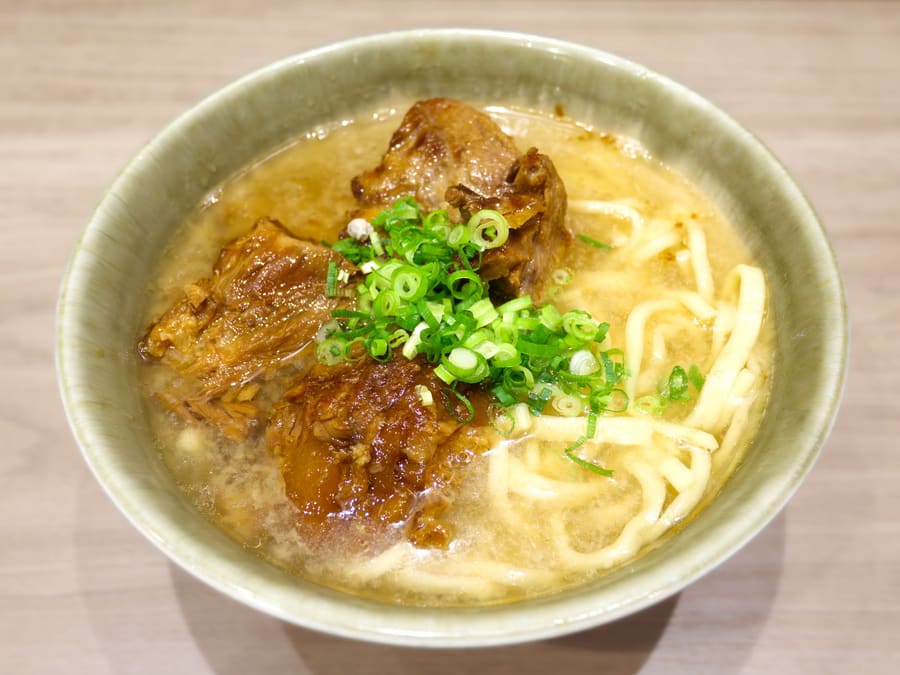 Nago-style Okinawa soba with wide, flat wheat noodles and tender soki pork rib.