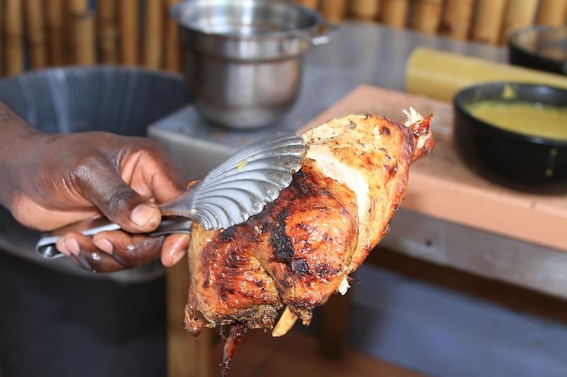 Freshly jerked chicken smoked over pimento wood on the roadside.
