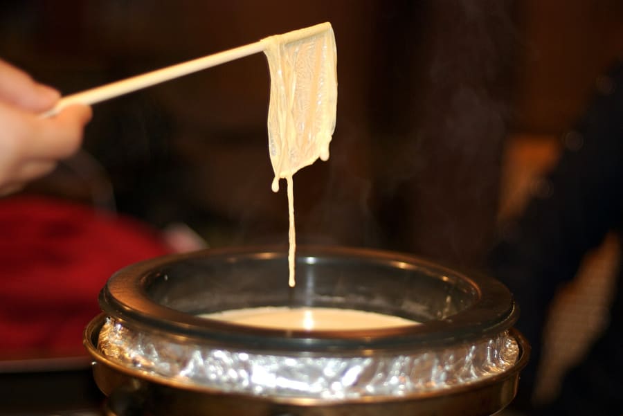 Freshly made rolls of thick Nikko yuba simmered in light dashi broth.