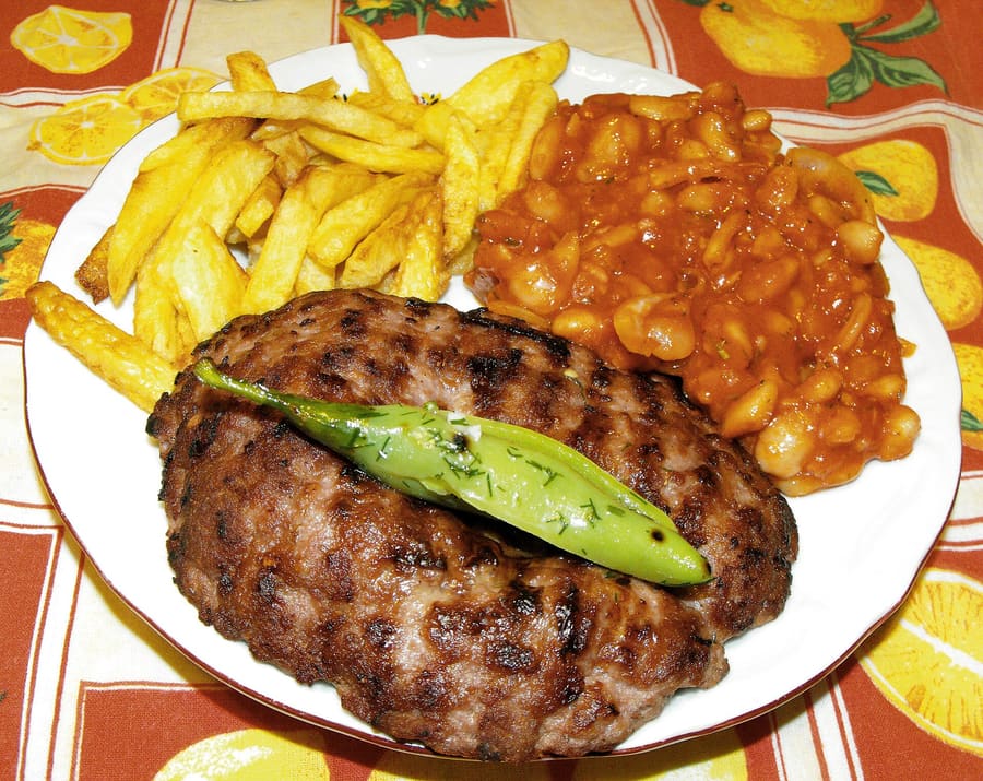 Pleskavica and southern meats cooked over open wood coal.