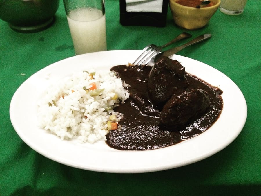 Mole negro served over chicken at a traditional fonda.