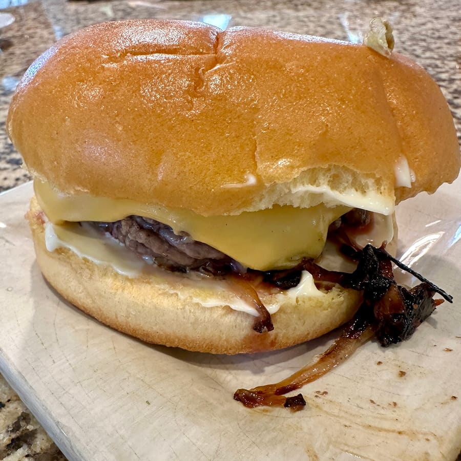 The Oklahoma fried onion burger features paper-thin onions seared directly into beef patties.