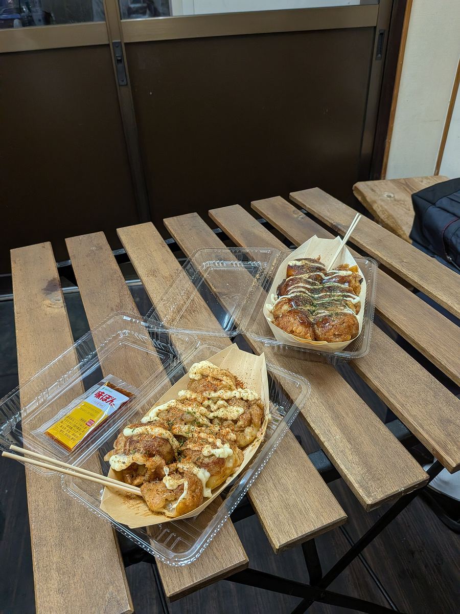 Takoyaki iron plates shape dashi batter and octopus into scalding snacks across Namba.