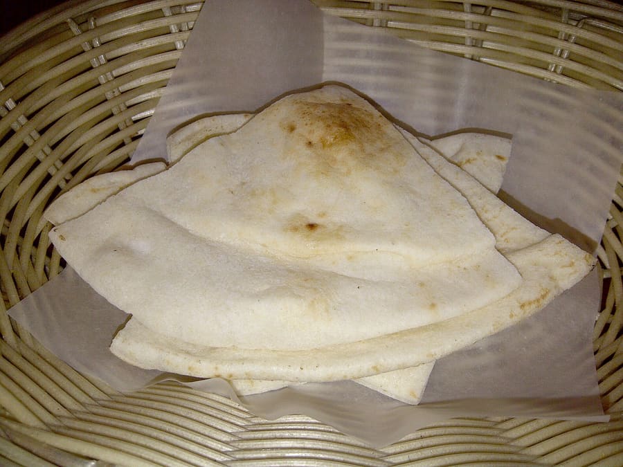 Pide cooked in traditional wood-fired hearths across Denizli province.