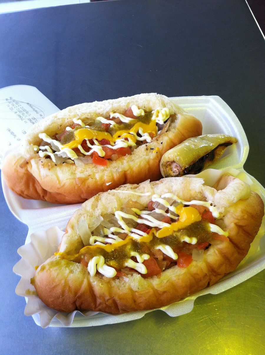 A classic Sonoran hot dog wrapped in bacon and topped with pinto beans, onions, and mayo.