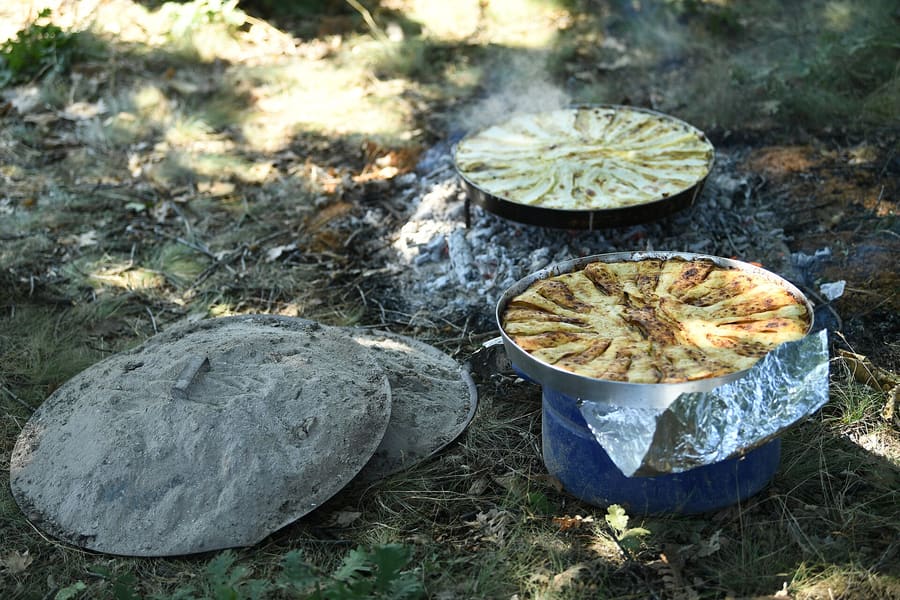 Fliya is traditionally baked layer by layer using a metal dome lid called a saç.