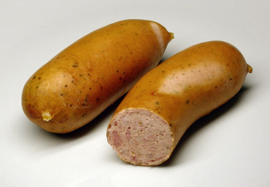 Six charcoal-grilled sausages served on sauerkraut at Historische Wurstkuchl.