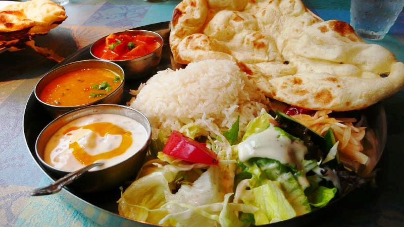 A classic North Indian vegetarian thali served at a traditional mess near Swarg Ashram.