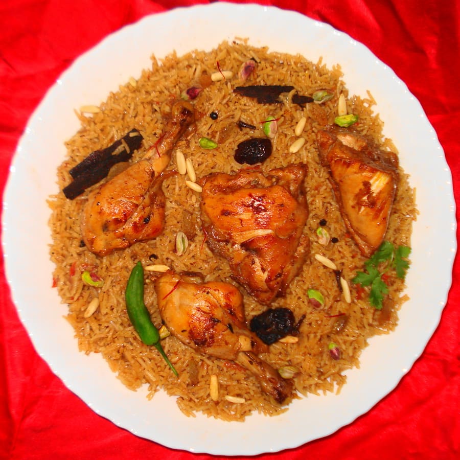Traditional spiced lamb kabsa served over long-grain rice.