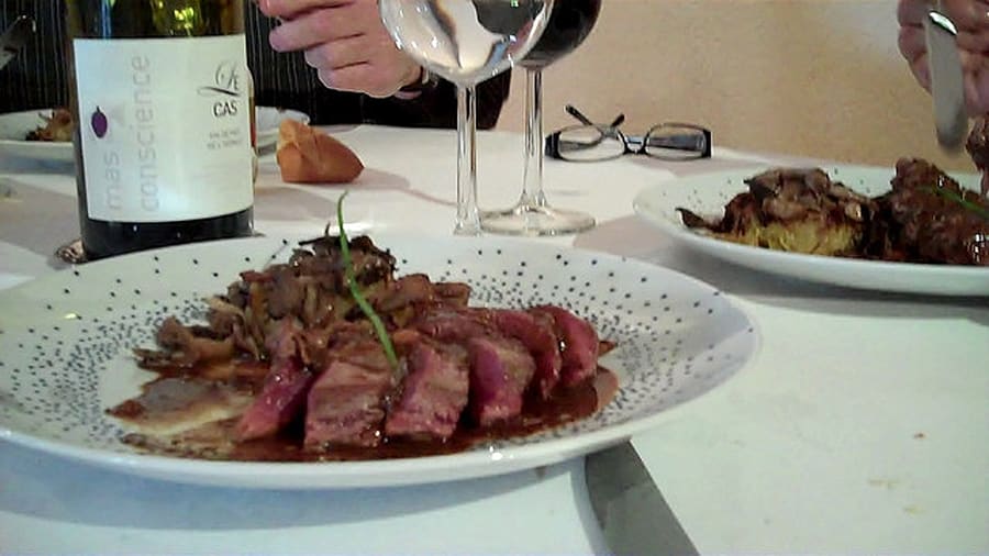 Canard à la rouennaise served with traditional red wine reduction sauce.