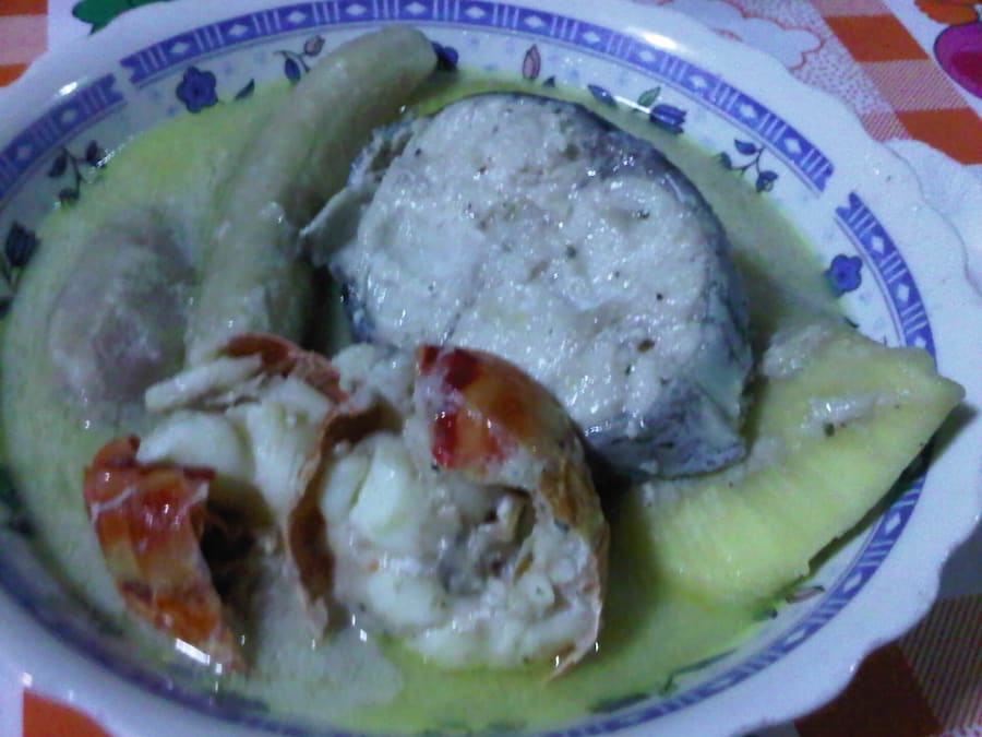 Rondón, the traditional Raizal slow-cooked stew of fish, snail, breadfruit, and yucca in coconut broth.