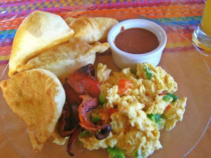 Golden fry jacks served hot with refried beans and eggs.