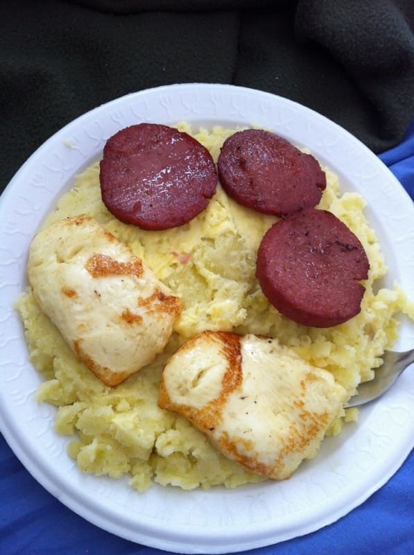 Mangú topped with pickled red onions, served as a daily breakfast fixture.