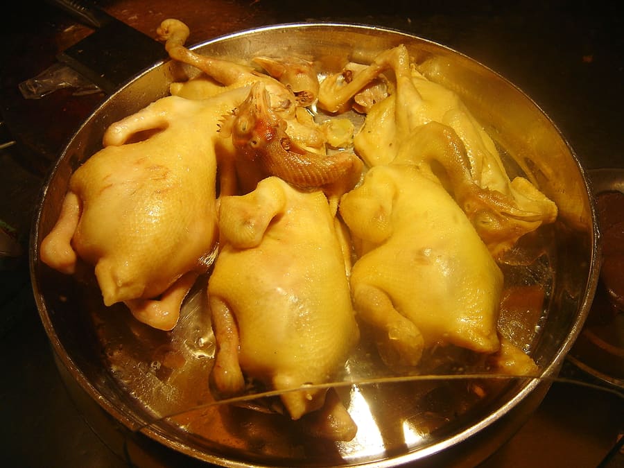 Slices of poached Wenchang chicken served with citrus-garlic soy dip.