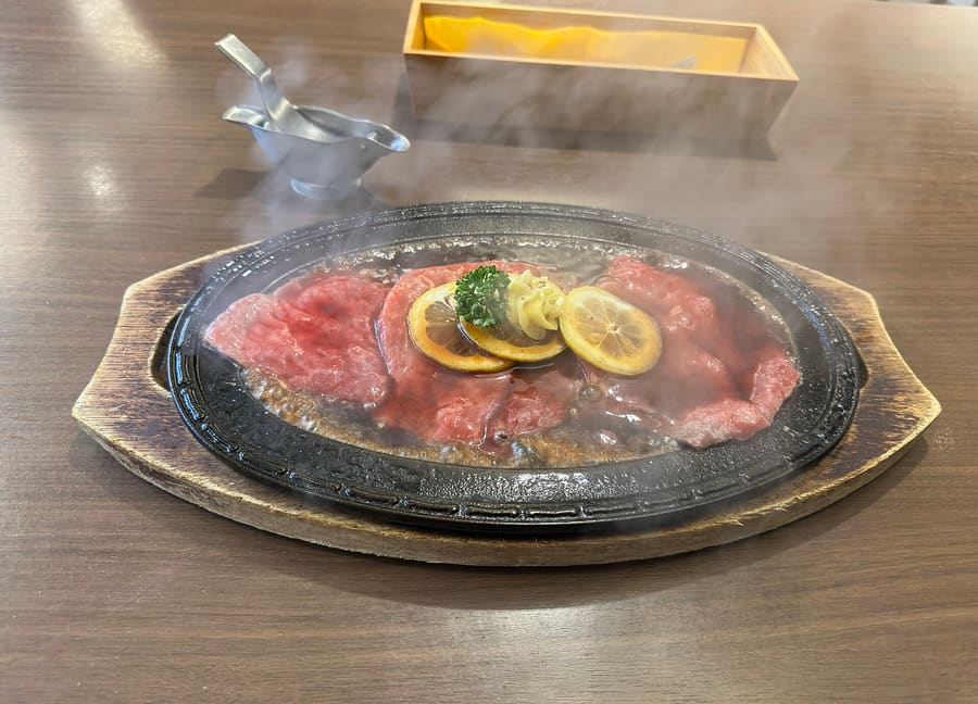 Sasebo lemon steak served sizzling on hot iron with sweet citrus soy sauce.