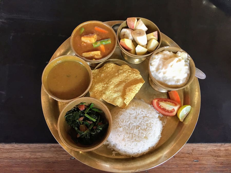 Traditional Tharu dish of ghonghi snails served with spicy gravy.