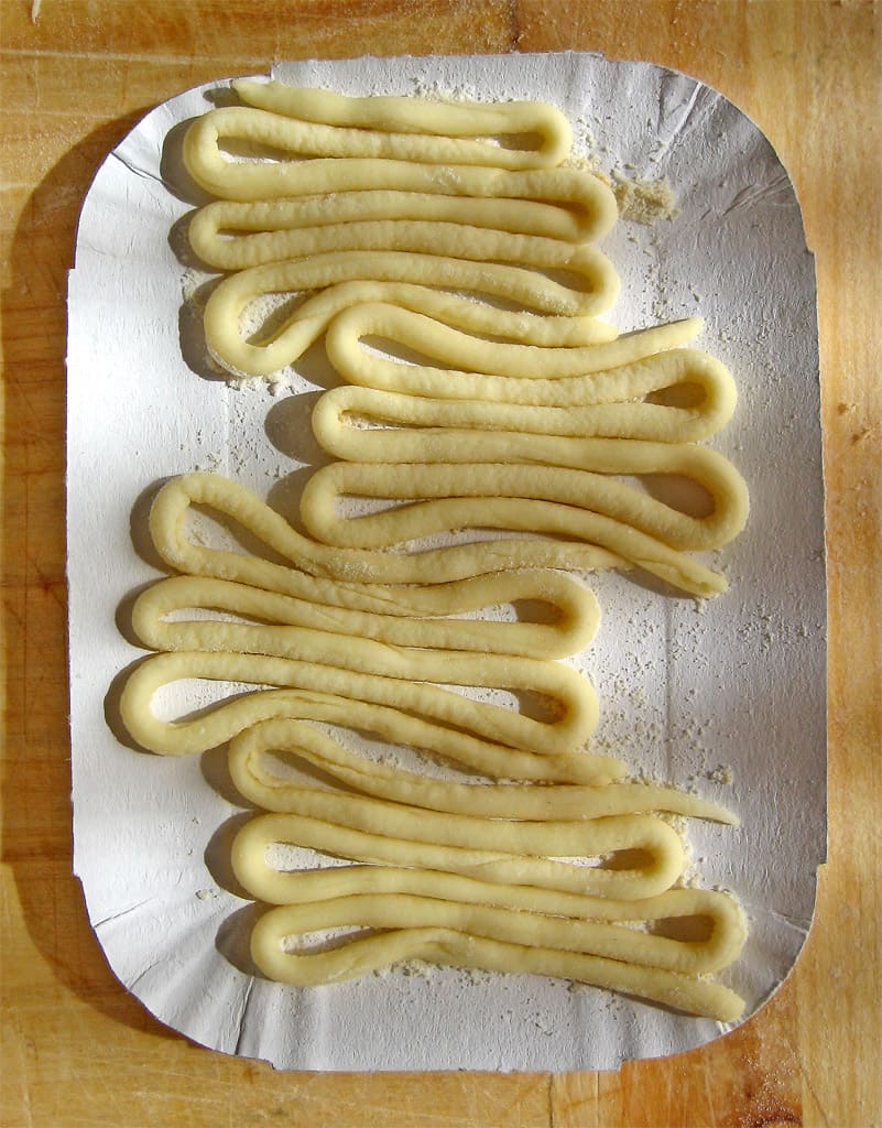 Hand-rolled pici pasta served with traditional aglione garlic sauce