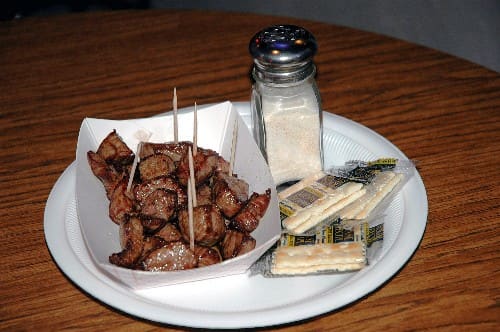 Cubed lamb chislic served hot with garlic salt and crackers.