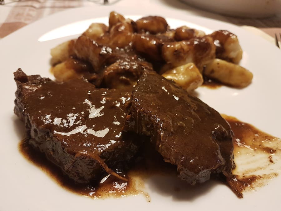 Traditional Pašticada served with handmade potato gnocchi.