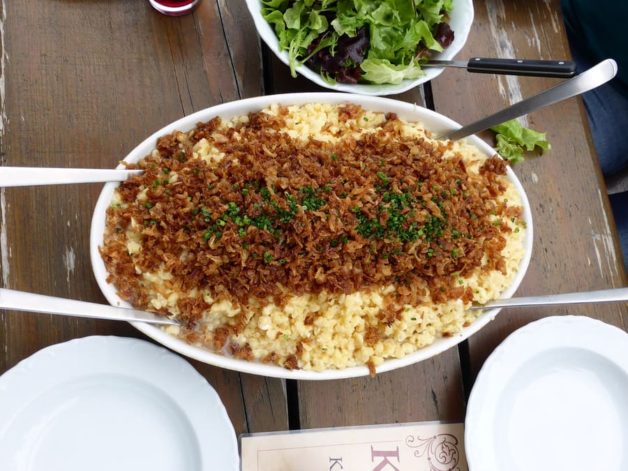 Kasspatzln served straight from the skillet, layered with local mountain cheese.