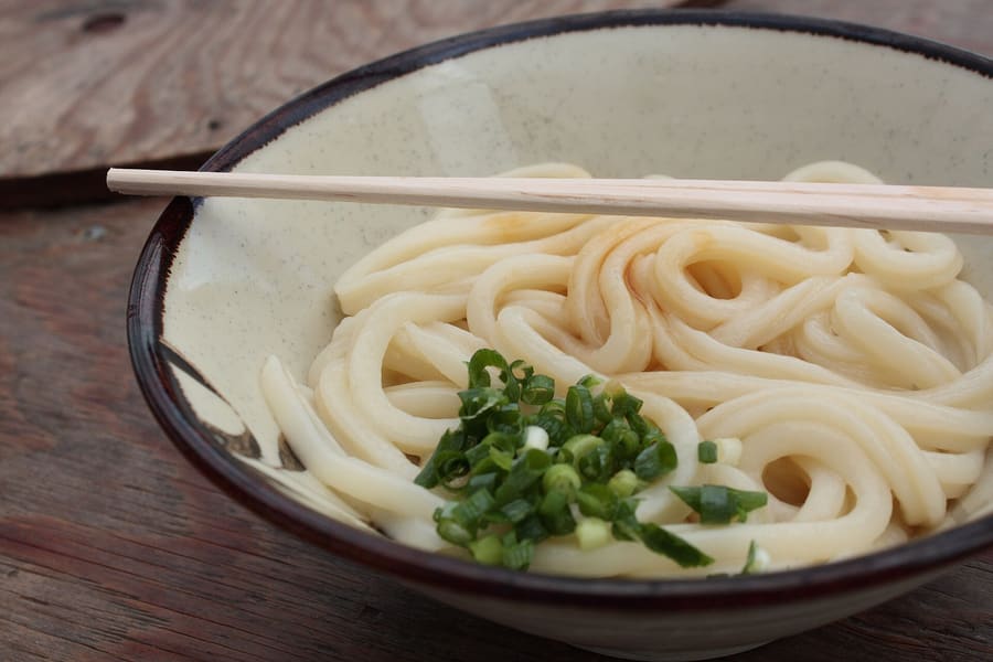 Self-service Sanuki udon served fresh at a neighborhood shop in downtown Takamatsu.