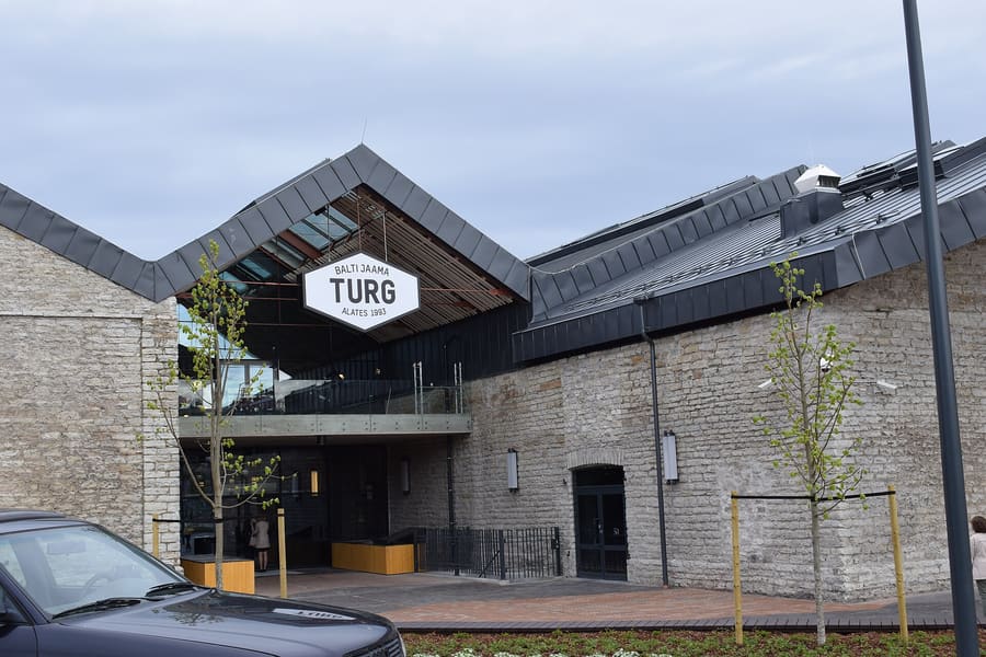 Balti Jaama Turg market hall, where food stalls serve street food downstairs and fresh local produce above.