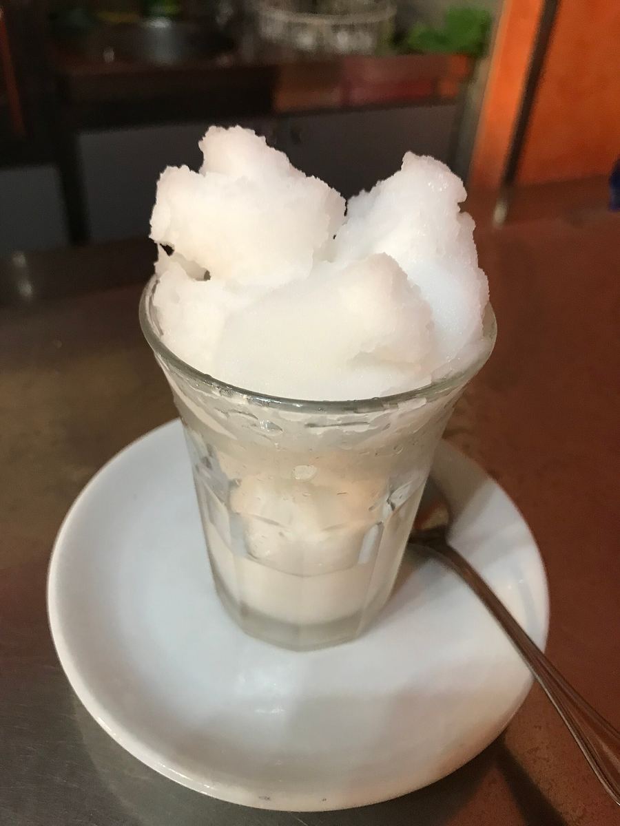 Almond granita served with fresh brioche at a side-street cafe.