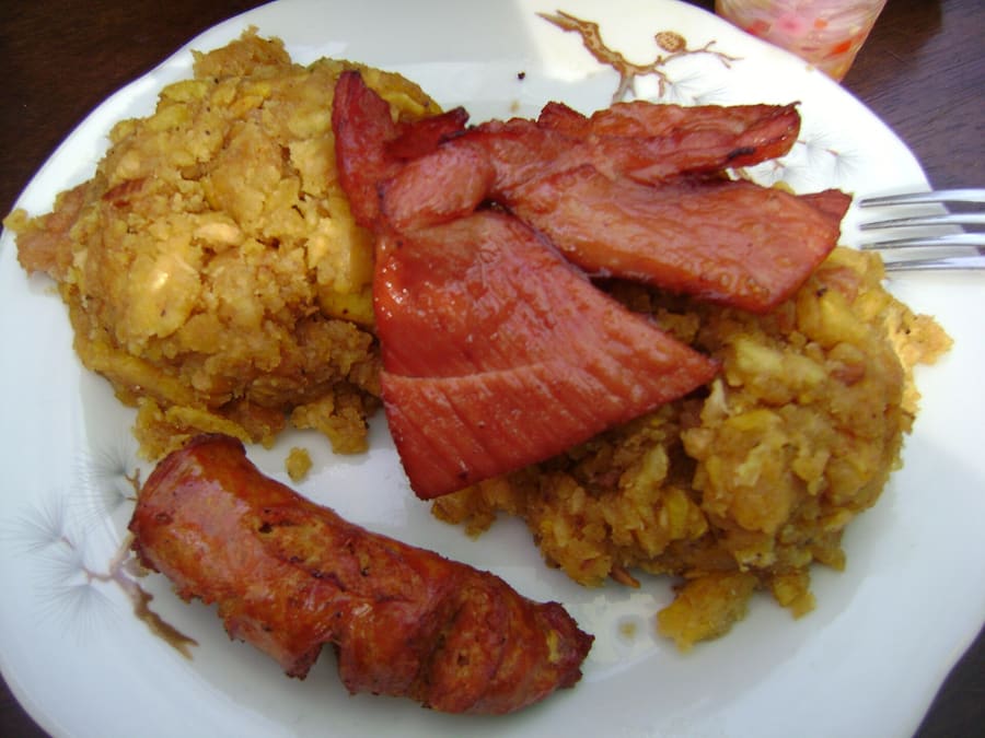 Tacacho con cecina served with pickled cocona pepper.
