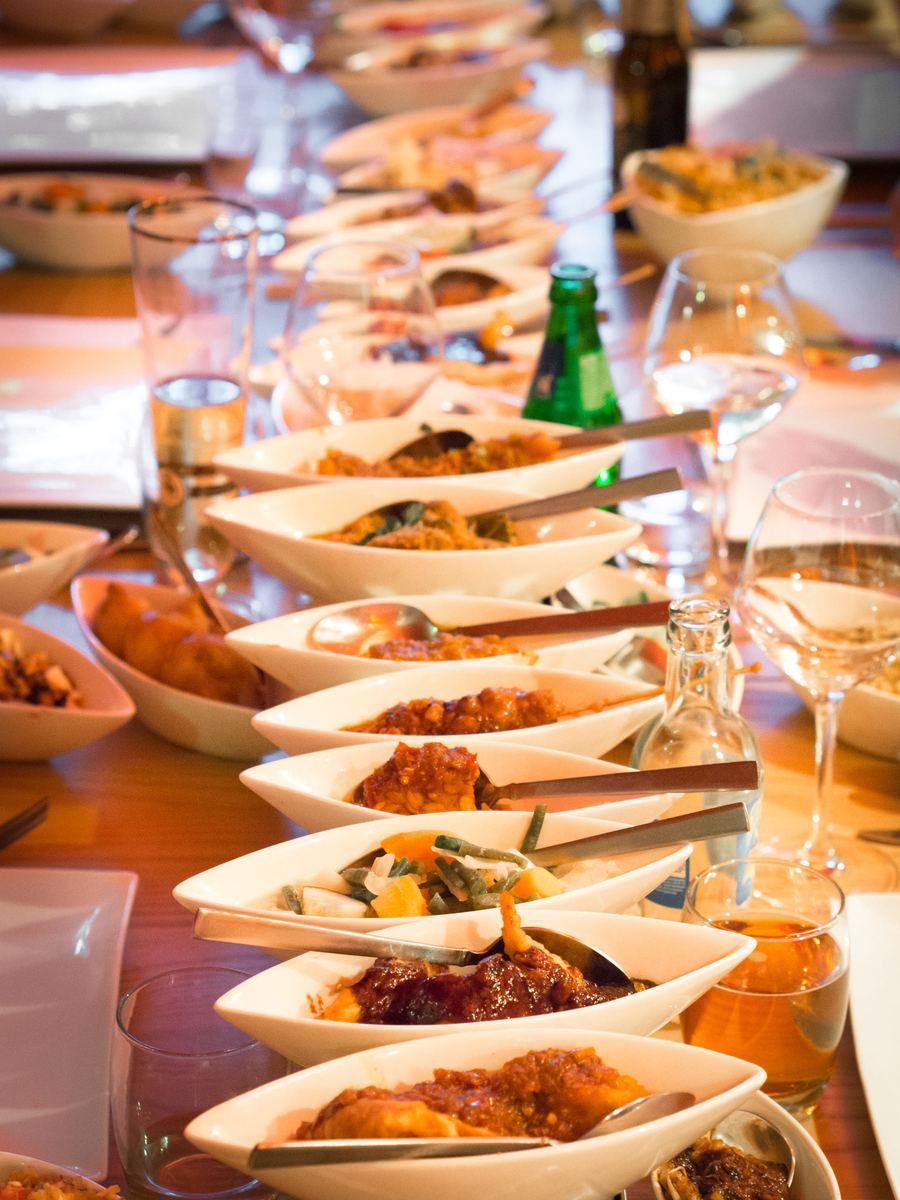 A traditional multi-dish Indonesian rijsttafel spread in Den Haag.