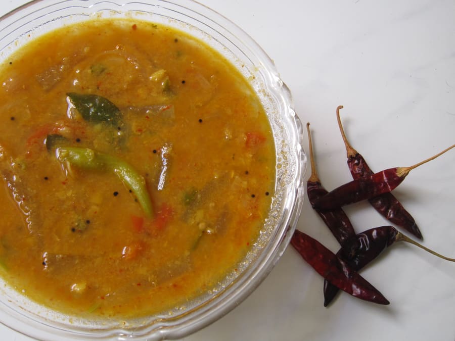 A traditional South Indian thali served on a fresh banana leaf.